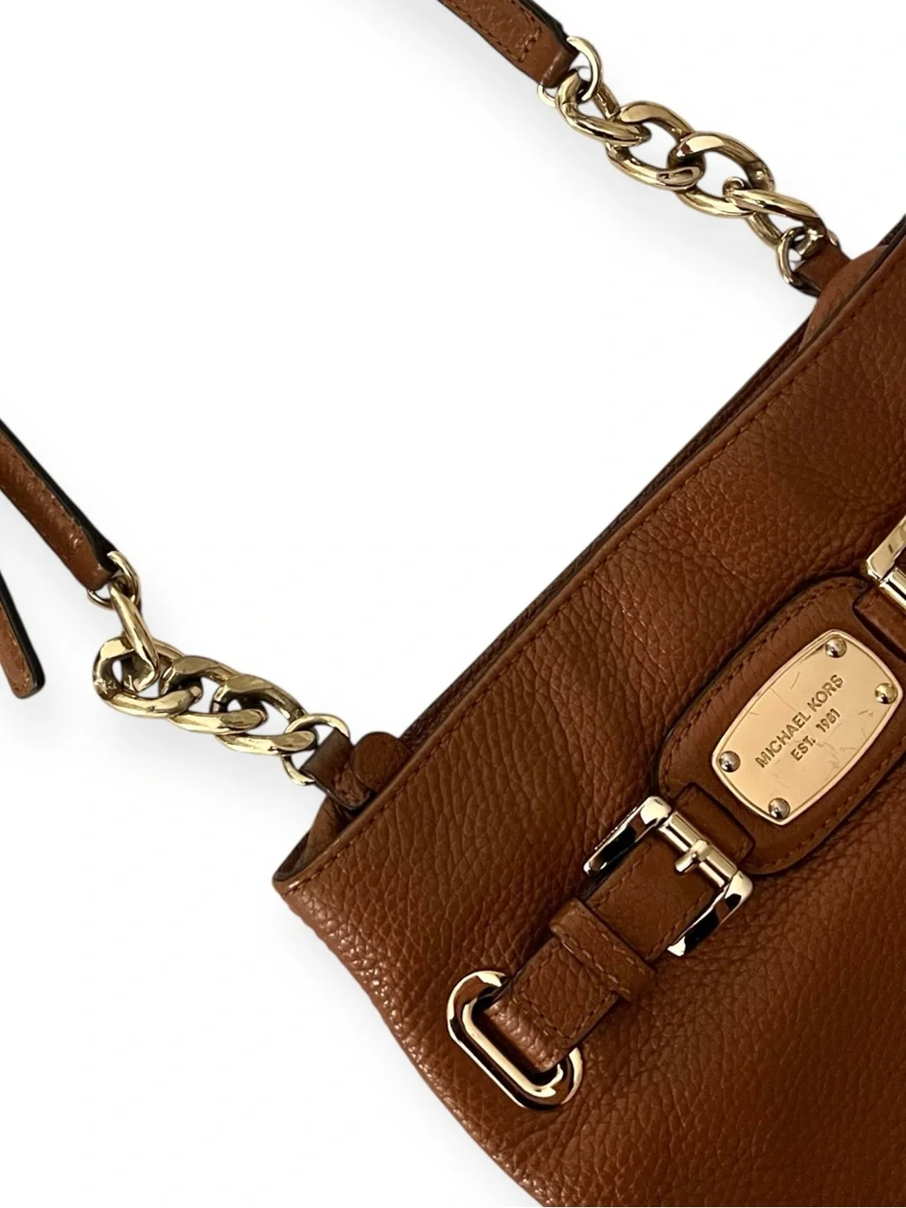 Michael Kors features 	•	genuine
